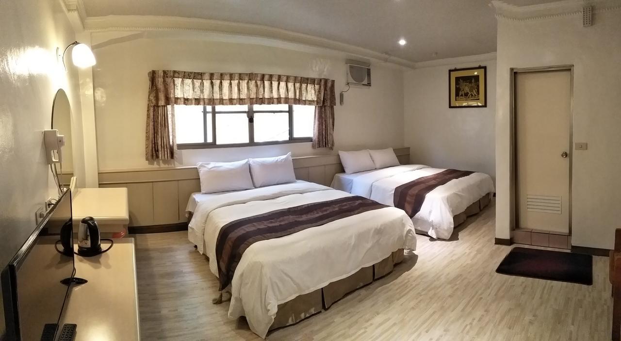 Minren Hotel Yuchi Quarto foto